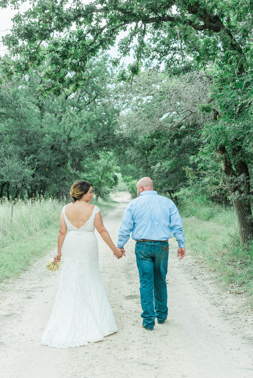 couple walking texas hill country wedding