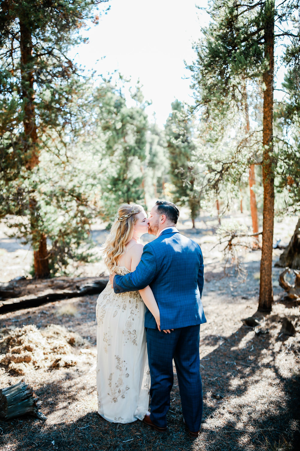 couple kissing at Buena Vista Colorado wedding at the wolf den