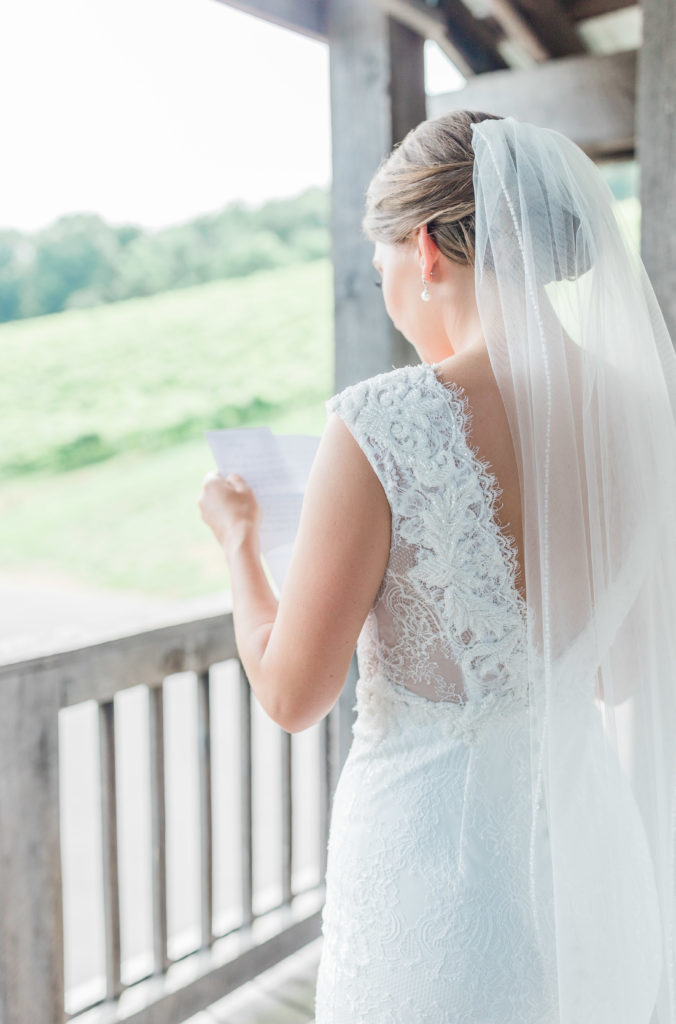 bride reading her letter from groom