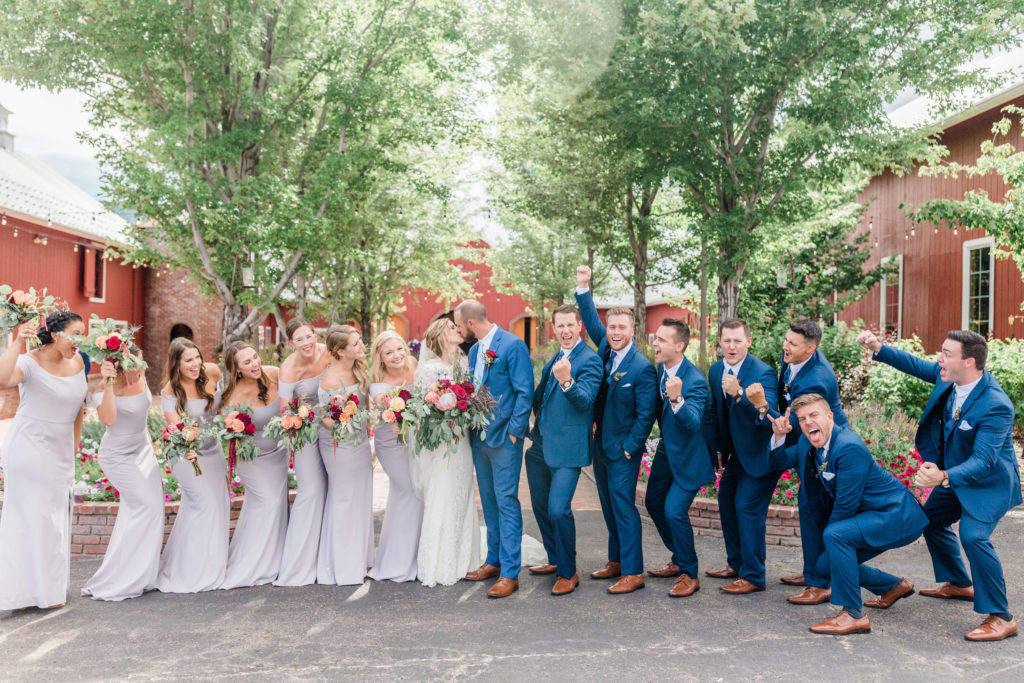 bridal party shouting in courtyard of Crooked willow Farms