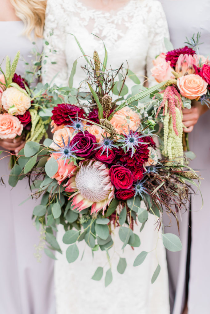 boho bridal bouquet with king protea, dahlias and roses