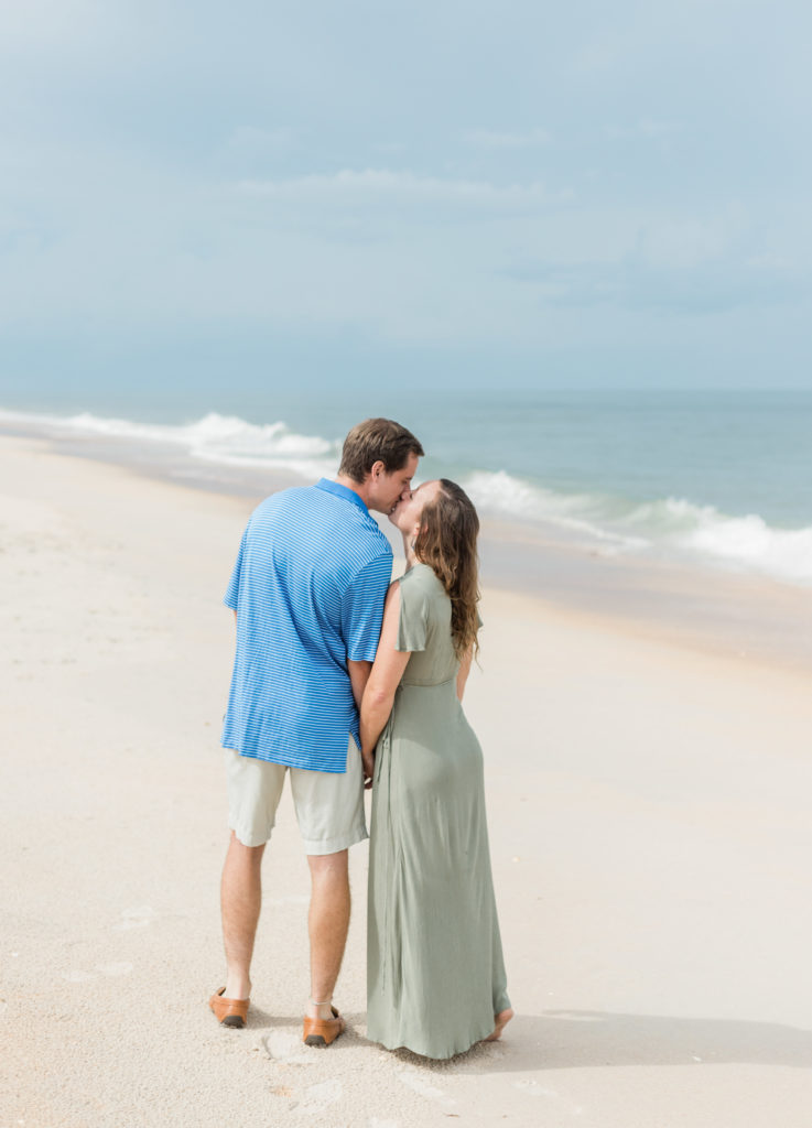 Couple kissing during Hammock Beach engagement session