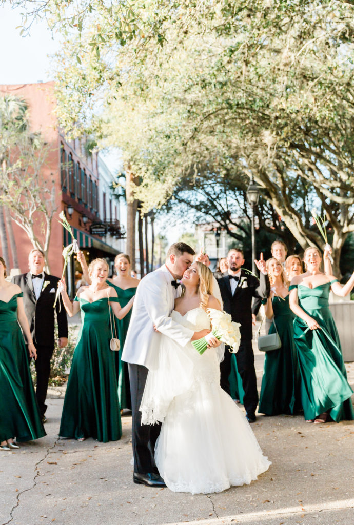 Couple with bridal party at St. Augustine Cathedral Basilica wedding.l