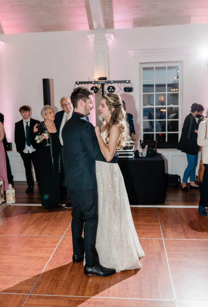 Couple dancing at their February White Room wedding. 
