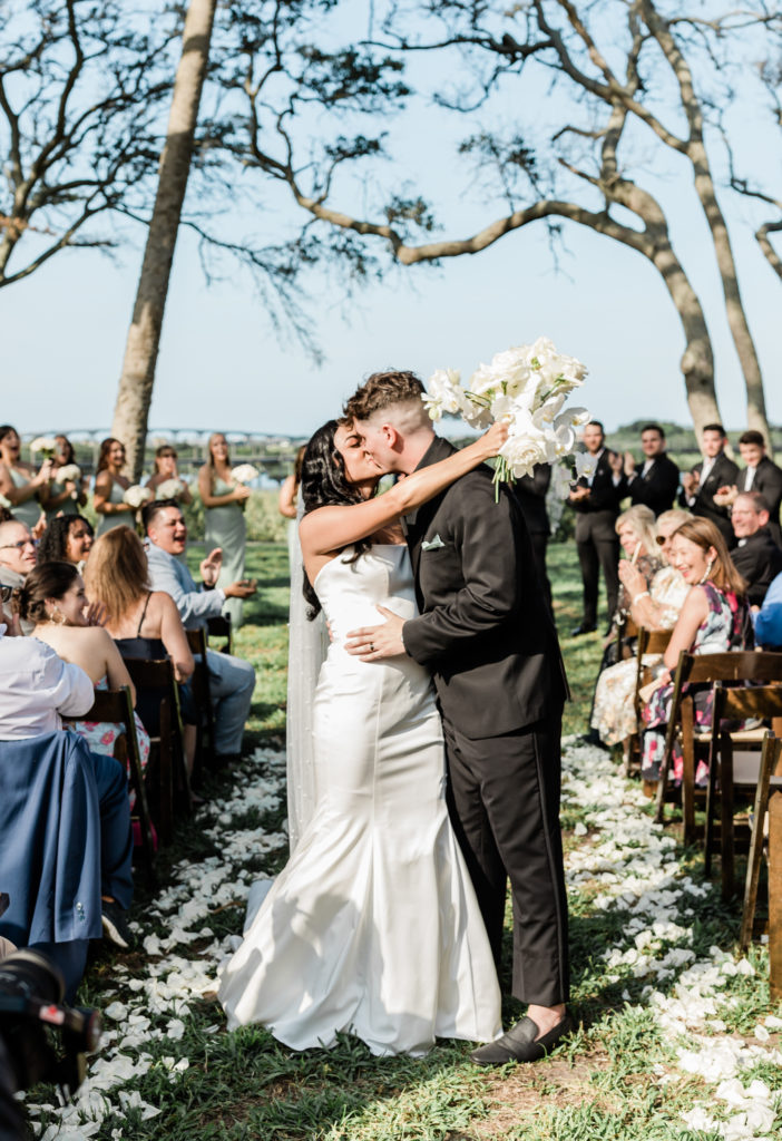 Couple kissing during ceremony at Fountain of Youth wedding in St. Augustine, Florida.