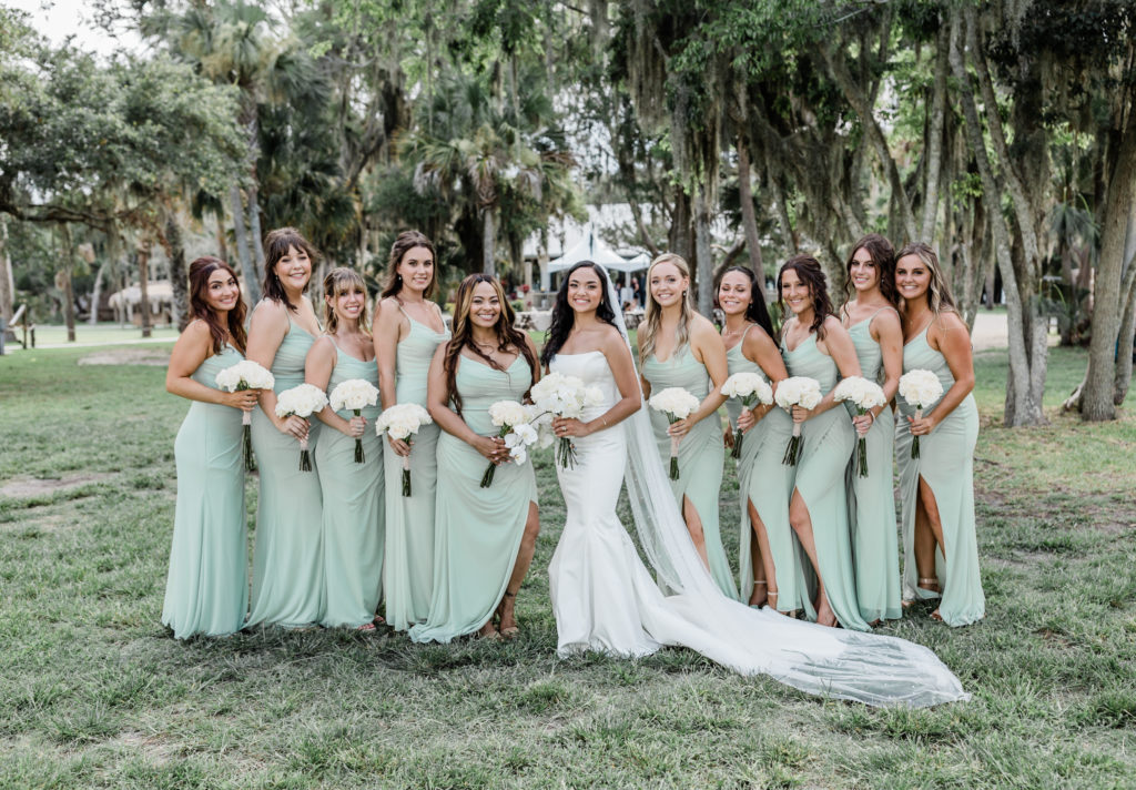 Bride with bridesmaids at Fountain of Youth. 